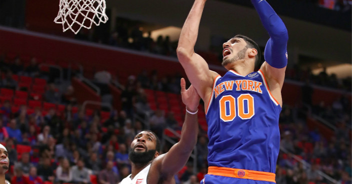 DETROIT, MI - DECEMBER 22: Enes Kanter #00 of the New York Knicks grabs a rebound next to Andre Drummond #0 of the Detroit Pistons during the second half at Little Caesars Arena on December 22, 2017 in Detroit, Michigan. NOTE TO USER: User expressly acknowledges and agrees that, by downloading and or using this photograph, User is consenting to the terms and conditions of the Getty Images License Agreement. (Photo by Gregory Shamus/Getty Images)