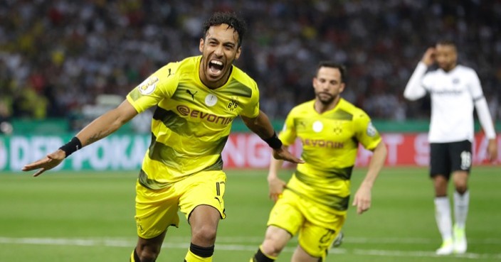 Dortmund's Pierre-Emerick Aubameyang, left, celebrates after scoring his side's 2nd goal during the German soccer cup final match between Borussia Dortmund and Eintracht Frankfurt in Berlin, Germany, Saturday, May 27, 2017. (AP Photo/Michael Sohn)