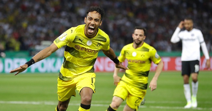Dortmund's Pierre-Emerick Aubameyang, left, celebrates after scoring his side's 2nd goal during the German soccer cup final match between Borussia Dortmund and Eintracht Frankfurt in Berlin, Germany, Saturday, May 27, 2017. (AP Photo/Michael Sohn)