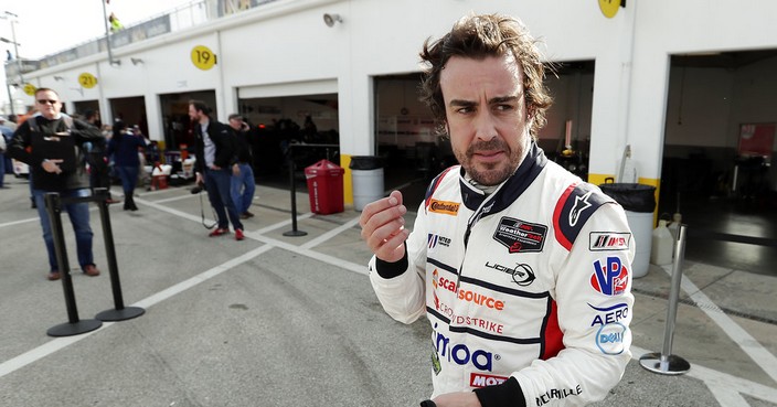 Fernando Alonso, of Spain, leaves his garage after a practice session for the IMSA 24-hour auto race at Daytona International Speedway, Friday, Jan. 26, 2018, in Daytona Beach, Fla. (AP Photo/John Raoux)