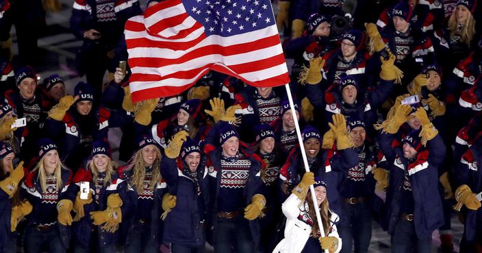 Erin Hamlin carries the flag of the United States during the opening ceremony of the 2018 Winter Olympics in Pyeongchang, South Korea, Friday, Feb. 9, 2018. (Sean Haffey/Pool Photo via AP)