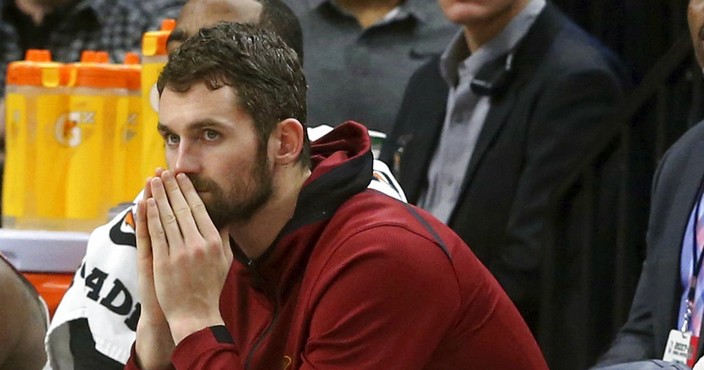 FILE - In this Jan. 8, 2018, file photo, Cleveland Cavaliers' Kevin Love watches from the bench in the second half of an NBA basketball game against the Minnesota Timberwolves in Minneapolis. Love will miss two months with a broken left hand, but he does not need surgery. Love broke the fifth metacarpal Tuesday, Jan. 30, in the first quarter of a loss at Detroit. (AP Photo/Jim Mone, File)