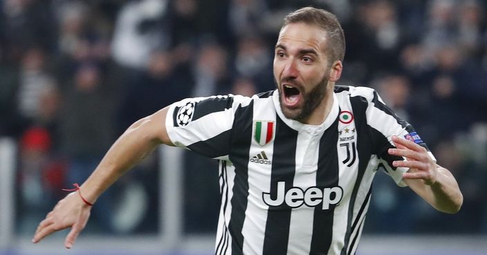 Juventus' Gonzalo Higuain celebrates after scoring his side's opening goal during the Champions League, round of 16, first-leg soccer match between Juventus and Tottenham Hotspurs, at the Allianz Stadium in Turin, Italy, Tuesday, Feb. 13, 2018. (AP Photo/Antonio Calanni)