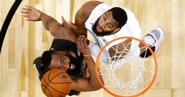 Team Stephen's James Harden, left, of the Houston Rockets, and Team LeBron's Paul George, of the Oklahoma City Thunder, wait for a rebound during the second half of an NBA All-Star basketball game, Sunday, Feb. 18, 2018, in Los Angeles. (Mike Nelson via AP, Pool)