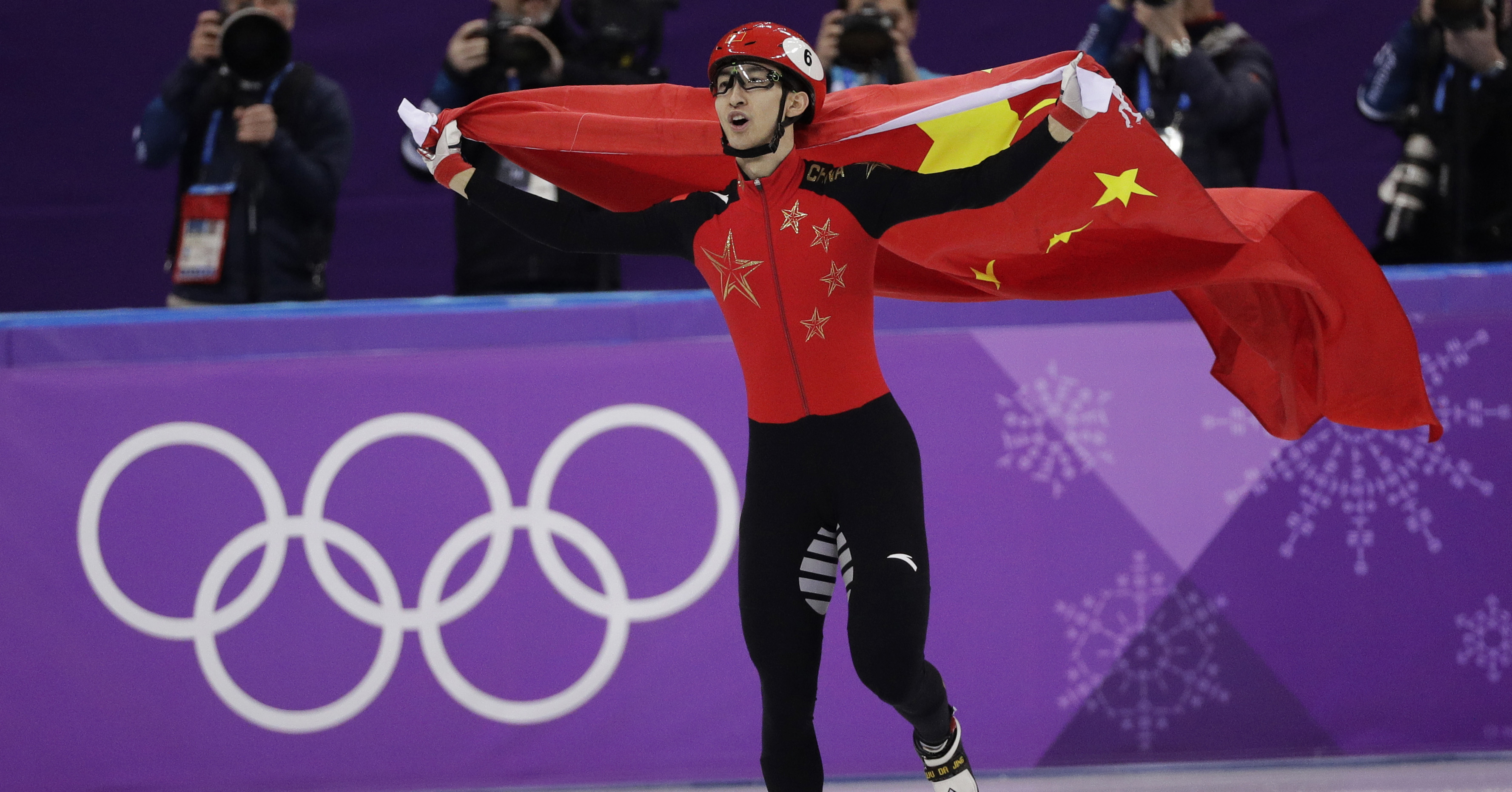 Wu Dajing of China celebrates after winning the men's 500 meters short track speedskating A final in the Gangneung Ice Arena at the 2018 Winter Olympics in Gangneung, South Korea, Thursday, Feb. 22, 2018. (AP Photo/David J. Phillip)
