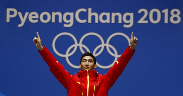 Gold medalist in the men's 500 meters short track speedskating Wu Dajing of China poses during the medals ceremony at the 2018 Winter Olympics in Pyeongchang, South Korea, Friday, Feb. 23, 2018. (AP Photo/Charlie Riedel)