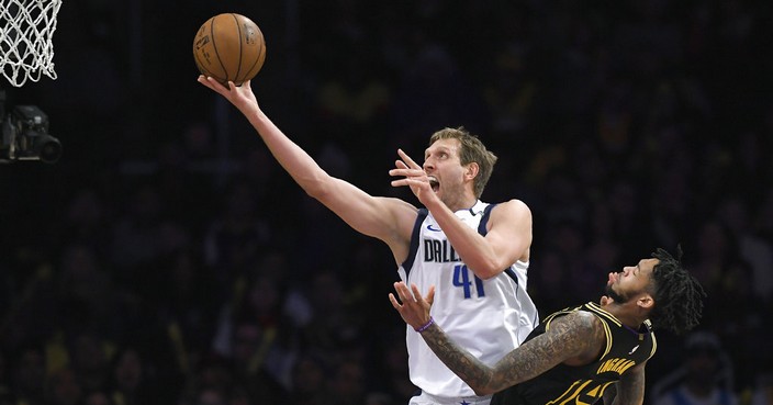 Dallas Mavericks forward Dirk Nowitzki, left, of Germany, shoots as Los Angeles Lakers forward Brandon Ingram defends during the second half of an NBA basketball game Friday, Feb. 23, 2018, in Los Angeles. The Lakers won 124-102. (AP Photo/Mark J. Terrill)