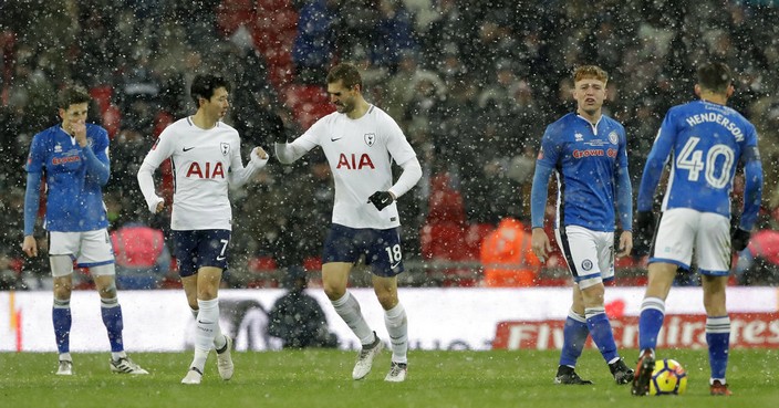 Tottenham Hotspur's Fernando Llorente, (18), celebrates with teammate Tottenham Hotspur's Son Heung-min after he scores his sides 2nd goal of the game during the English FA Cup fifth round replay soccer match between Tottenham Hotspur and Rochdale at Wembley stadium in London, Wednesday, Feb. 28, 2018. (AP Photo/Matt Dunham)