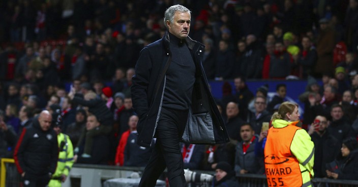 Manchester United head coach Jose Mourinho walks to the dressing room after his side were defeated by Sevilla during the Champions League round of 16 second leg soccer match at Old Trafford in Manchester, England, Tuesday, March 13, 2018. Sevilla won the game 2-1 and go through to the quarterfinals .(AP Photo/Dave Thompson)