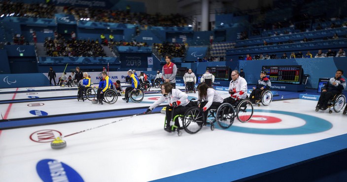 Cananda's Marie Wright throws a stone during the Wheelchair Curling Round Robin Session 6 at the Gangneung Curling Centre at the Pyeongchang 2018 Paralympic Winter Games in Gangneung, South Korea, Monday, March 12, 2018. (Thomas Lovelock/OIS/IOC via AP)