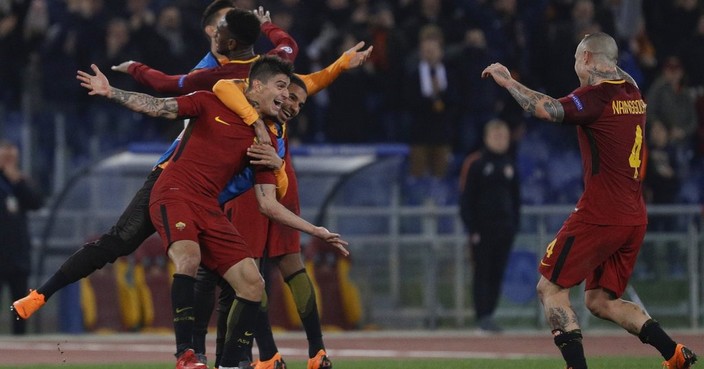 Roma players celebrate their side's 1-0 win at the end of a Champions League round of 16 second-leg soccer match between Roma and Shakhtar Donetsk, at the Rome Olympic stadium, Tuesday, March 13, 2018. (AP Photo/Gregorio Borgia)
