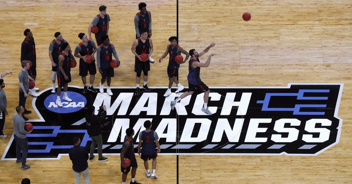 Cal State Fullerton's Dominik Heinzl (21) shoots from half court during practice at the men's NCAA college basketball tournament in Detroit, Thursday, March 15, 2018. (AP Photo/Paul Sancya)