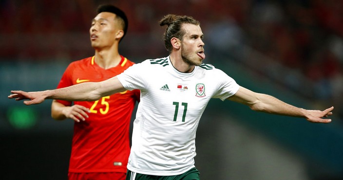 Wales' Gareth Bale celebrates after a goal against China at the 2018 China Cup International Football Championship in Nanning in China's Guangxi province on Thursday, March 22, 2018. (Color China Photo via AP) CHINA OUT