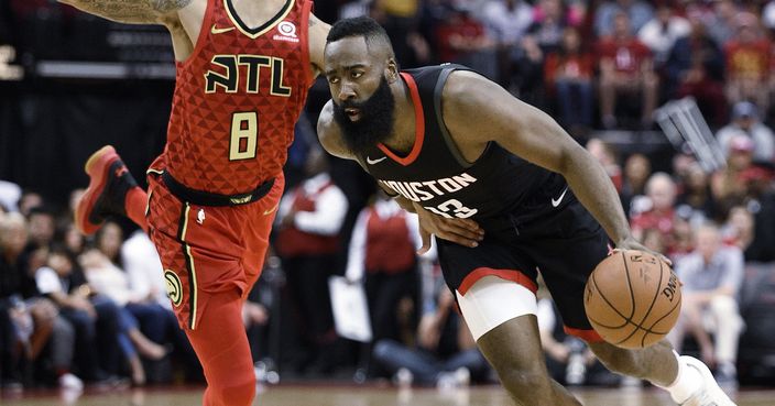 Houston Rockets guard James Harden, right, drives past Atlanta Hawks guard Damion Lee (8) during the first half of an NBA basketball game, Sunday, March 25, 2018, in Houston. (AP Photo/Eric Christian Smith)