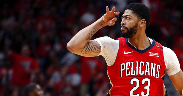 New Orleans Pelicans forward Anthony Davis reacts after making a 3-point shot during the first half of Game 4 of the team's first-round NBA basketball playoff series against the Portland Trail Blazers in New Orleans, Saturday, April 21, 2018. (AP Photo/Scott Threlkeld)
