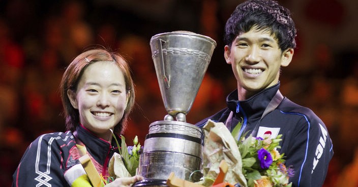 Japan's Kasumi Ishikawa, left, and  Maharu Yoshimura  pose with the trophy after winning their final match of the mixed doubles against Taiwan's Chen Chien-An and Cheng I-Ching at the Table Tennis World Championships in Duesseldorf, Germany, Saturday, June 3, 2017. (Rolf Vennenbernd/dpa via AP)