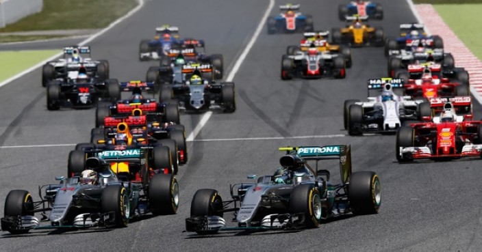 Mercedes drivers Lewis Hamilton of Britain, foreground left, and Nico Rosberg of Germany, center, enter the first curve during the Spanish Formula One Grand Prix at the Barcelona Catalunya racetrack in Montmelo, just outside Barcelona, Spain, Sunday, May 15, 2016. (AP Photo/Manu Fernandez)