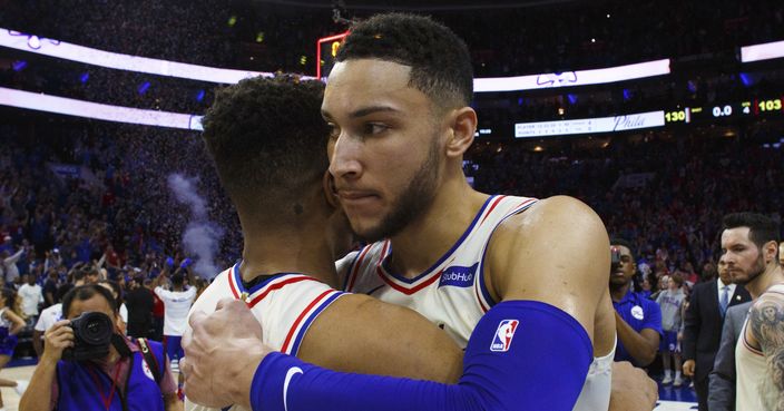Philadelphia 76ers' Ben Simmons, right, gives Markelle Fultz a hug after Game 1 of the team's first-round NBA basketball playoff series against the Miami Heat, Saturday, April 14, 2018, in Philadelphia. The 76ers won 130-103. (AP Photo/Chris Szagola)