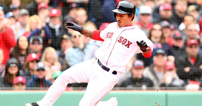 BOSTON, MA - APRIL 14:  Tzu-Wei Lin #5 of the Boston Red Sox slides safely in to home plate in the fourth inning of a game against the Baltimore Orioles at Fenway Park on April 14, 2018 in Boston, Massachusetts.  (Photo by Adam Glanzman/Getty Images)