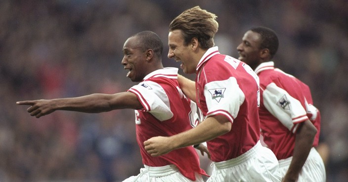 2 Nov 1996:  Ian Wright of Arsenal (centre) leads the celebrations with a little help from teammates Paul Merson (foreground) and Patrick Vieira (background)  during the FA Carling Premier league match between Wimbledon and Arsenal at Selhurst Park in London. The match ended in a 2-2 draw. Mandatory Credit: Mike Hewitt/Allsport