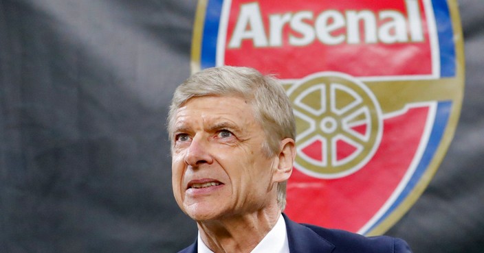 FILE - In this Thursday, March 8, 2018 file photo Arsenal's manager Arsene Wenger waits for the kick-off of the Europa League, round of 16 first-leg soccer match between AC Milan and Arsenal, at the Milan San Siro stadium, Italy. Arsenal manager Arsene Wenger says he will leave the English club at the end of the season after more than 21 years in charge. (AP Photo/Antonio Calanni, File)