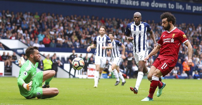 Liverpool's Mohamed Salah scores his side's second goal of the game, during the English Premier League soccer match between West Bromwich Albion and Liverpool, at The Hawthorns, West Bromwich, England, Saturday April 21, 2018. (Nigel French/PA via AP)