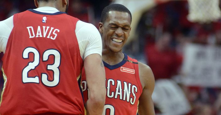 New Orleans Pelicans guard Rajon Rondo (9) and forward Anthony Davis (23) celebrate during the second half of Game 3 of a first-round NBA basketball playoff series against the Portland Trail Blazers in New Orleans, Thursday, April 19, 2018. The Pelicans won 119-102, and lead the series 3-0. (AP Photo/Veronica Dominach)