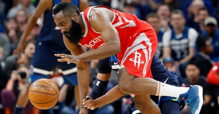 Houston Rockets' James Harden, front, and Minnesota Timberwolves' Taj Gibson become entangled while chasing the ball during the first half of Game 4 in an NBA basketball first-round playoff series Monday, April 23, 2018, in Minneapolis. (AP Photo/Jim Mone)