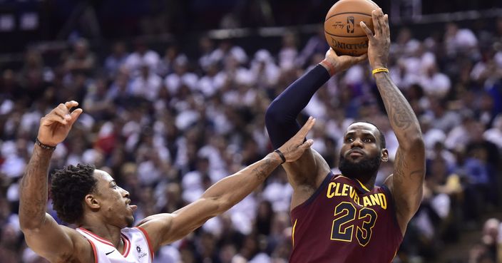 Cleveland Cavaliers forward LeBron James (23) shoots over Toronto Raptors guard DeMar DeRozan (10) during the second half of Game 2 of an NBA basketball playoffs second-round series Thursday, May 3, 2018, in Toronto. (Frank Gunn/The Canadian Press via AP)