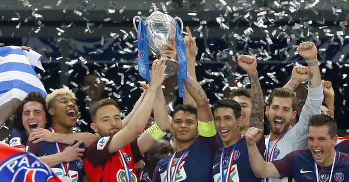PSG captain Thiago Silva, center right, and Les Herbiers captain Sebastien Flochon, center left, lift the French Cup 2018 trophy with PSG players : Adrien Rabiot, left, Presnel Kimpembe, 2nd left, Angel Di Maria, 3rd right, PSG goalkeeper Kevin Trapp, 2nd right, and Giovani Lo Celso, right, during the trophy ceremony at the Stade de France stadium in Saint-Denis, outside Paris, Tuesday, May 8, 2018. Paris Saint-Germain beat resilient third-division side Les Herbiers 2-0 to win the French Cup. (AP Photo/Michel Euler) PSG's Presnel Kimpembe