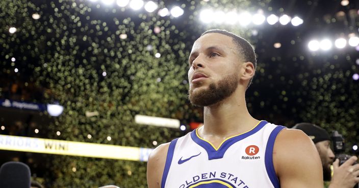 Confetti falls as Golden State Warriors' Stephen Curry walks off the court at the end of Game 5 of the team's NBA basketball second-round playoff series against the New Orleans Pelicans on Tuesday, May 8, 2018, in Oakland, Calif. Golden State won 113-104 to win the series. (AP Photo/Marcio Jose Sanchez)