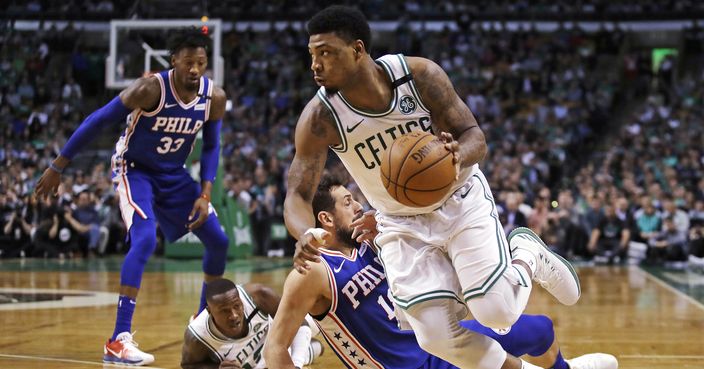 Boston Celtics guard Marcus Smart, right, drives past Philadelphia 76ers guard Marco Belinelli during the first quarter of Game 5 of an NBA basketball playoff series in Boston, Wednesday, May 9, 2018. (AP Photo/Charles Krupa)