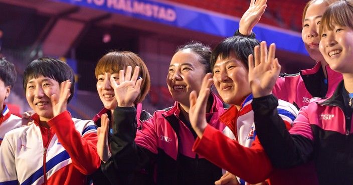 Members of North Korea and South Korea table tennis teams pose together for a group photo after deciding to combine their teams to avoid playing against each other in the Quarter Finals of the World Team Table Tennis Championships at Halmstad Arena in Halmstad, Sweden, Thursday May 2, 2018. Their quarter final match was canceled after North and South Korea decided to play together in the semi finals, rather than eliminate one of their teams in the quarter final. ( Jonas Ekstromer/TT via AP)