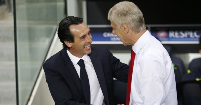 PSG head coach Unai Emery, left, greets Arsenal manager Arsene Wenger prior to the Champions League group A soccer match group between Paris Saint Germain and Arsenal at the Parc des Princes stadium in Paris, Tuesday, Sept. 13, 2016. (AP Photo/Francois Mori)