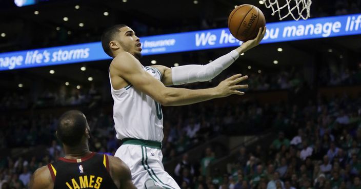 Boston Celtics forward Jayson Tatum (0) goes to the basket over Cleveland Cavaliers forward LeBron James (23) during the fourth quarter of Game 5 of the NBA basketball Eastern Conference finals Wednesday, May 23, 2018, in Boston. (AP Photo/Charles Krupa)