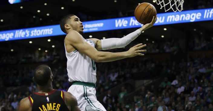 Boston Celtics forward Jayson Tatum (0) goes to the basket over Cleveland Cavaliers forward LeBron James (23) during the fourth quarter of Game 5 of the NBA basketball Eastern Conference finals Wednesday, May 23, 2018, in Boston. (AP Photo/Charles Krupa)