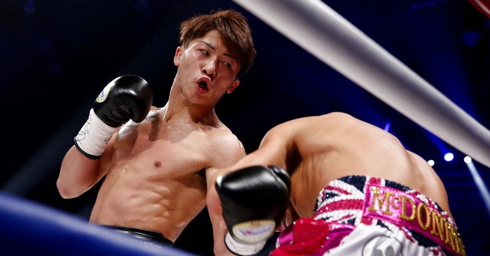 Japanese challenger Naoya Inoue, left, punches British Jamie McDonnell during the first round of their WBA World bantamweight title match in Tokyo Friday, May 25, 2018. Inoue won the match by a technical knockout in the round.(AP Photo/Shuji Kajiyama)