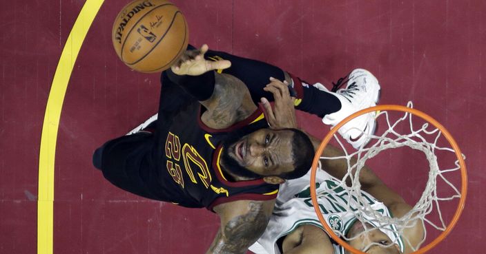 Cleveland Cavaliers' LeBron James, left, reaches for the ball over Boston Celtics' Al Horford during the second half of Game 6 of the NBA basketball Eastern Conference finals Friday, May 25, 2018, in Cleveland. The Cavaliers won 109-99. (AP Photo/Tony Dejak)