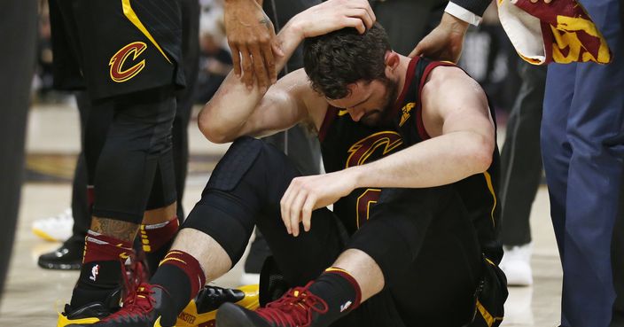 Cleveland Cavaliers' Kevin Love sits on the court while holding his head during the first half of Game 6 of the team's NBA basketball Eastern Conference finals against the Boston Celtics, Friday, May 25, 2018, in Cleveland. (AP Photo/Ron Schwane)