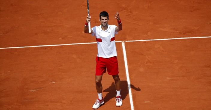 Serbia's Novak Djokovic celebrates winning his second round match of the French Open tennis tournament against Spain's Jaume Munar at the Roland Garros stadium in Paris, France, Wednesday, May 30, 2018. (AP Photo/Christophe Ena)