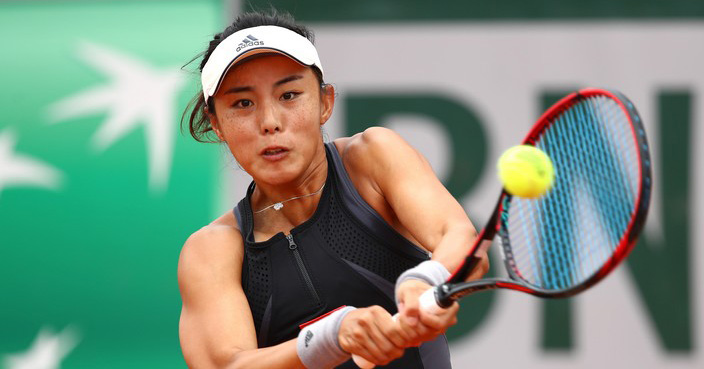 PARIS, FRANCE - JUNE 01:  Qiang Wang of China plays a backhand during the lades singles third round match against Yulia Putintseva of Kazhakstan during day six of the 2018 French Open at Roland Garros on June 1, 2018 in Paris, France.  (Photo by Cameron Spencer/Getty Images)