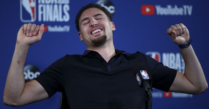 Golden State Warriors guard Klay Thompson laughs at a news conference after Game 2 of basketball's NBA Finals between the Warriors and the Cleveland Cavaliers in Oakland, Calif., Sunday, June 3, 2018. The Warriors won 122-103. (AP Photo/Ben Margot)