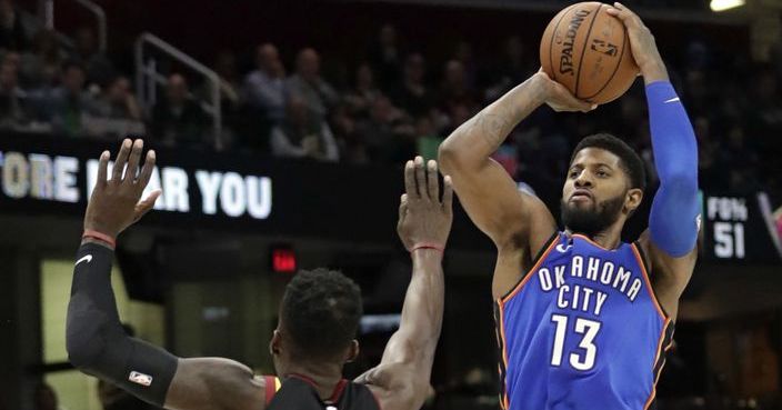 Oklahoma City Thunder's Paul George (13) shoots over Cleveland Cavaliers' Jeff Green (32) in the second half of an NBA basketball game, Saturday, Jan. 20, 2018, in Cleveland. The Thunder won 148-124. (AP Photo/Tony Dejak)