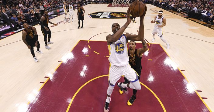 Golden State Warriors forward Kevin Durant (35) shoots in front of Cleveland Cavaliers guard George Hill (3) in the second half of Game 3 of basketball's NBA Finals, Wednesday, June 6, 2018, in Cleveland. The Warriors defeated the Cavaliers 110-102 to take a 3-0 lead in the series. (Kyle Terada/Pool Photo via AP)