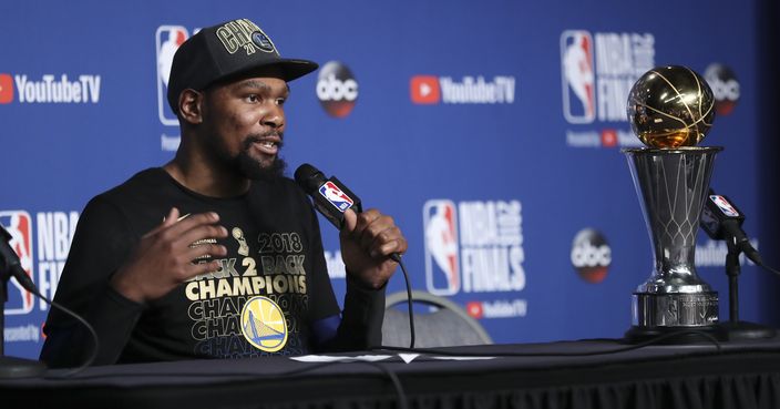 Golden State Warriors forward Kevin Durant speaks during a news conference following Game 4 of basketball's NBA Finals early Saturday, June 9, 2018, in Cleveland. The Warriors defeated the Cleveland Cavaliers 108-85 to take the title. Durant was named MVP of the finals. (AP Photo/Carlos Osorio)