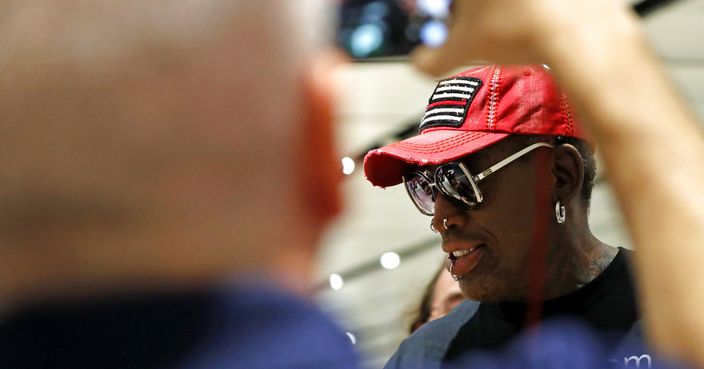 Former NBA basketball player Dennis Rodman arrives at Singapore's Changi Airport on Tuesday, June 12, 2018. (AP Photo/Wong Maye-E)