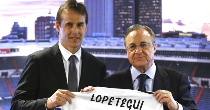 President of Real Madrid, Florentino Perez, right and newly appointed Real Madrid coach Julen Lopetegui pose for a photo, during a press conference in Madrid, Thursday, June 14, 2018. Lopetegui was the Spanish National team's coach but was fired on Wednesday, two days before Spain's opening match against Portugal, because he had accepted the job to coach Real Madrid next season. (AP Photo/Andrea Comas)