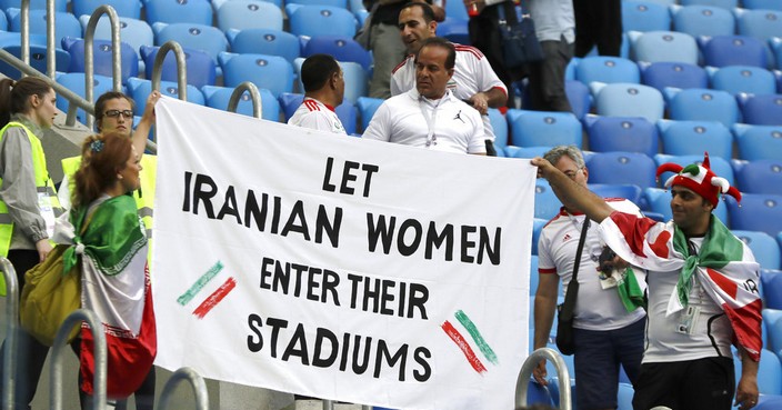 People supporting Iranian women are holding a banner at the stands during the group B match between Morocco and Iran at the 2018 soccer World Cup in the St. Petersburg Stadium in St. Petersburg, Russia, Friday, June 15, 2018. (AP Photo/Themba Hadebe)