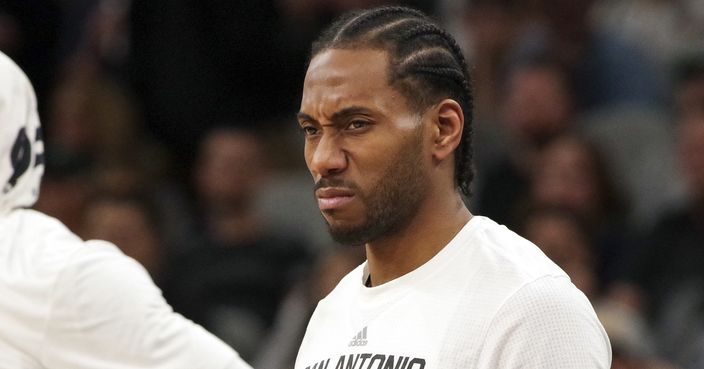 FILE- In this April 5, 2017, file photo, San Antonio Spurs forward Kawhi Leonard reacts to a play as he waits to enter the game during the first half of an NBA basketball game against the Los Angeles Lakers in San Antonio. A person familiar with the situation tells The Associated Press, Friday, June 15, 2018, that Leonard has told the Spurs that he would like to be traded this summer, the clearest sign yet that the relationship between the team and the All-Star is in disrepair. (AP Photo/Darren Abate, File)