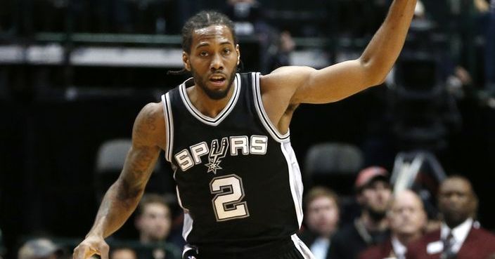 San Antonio Spurs forward Kawhi Leonard celebrates a basket against the Dallas Mavericks during the first half of an NBA basketball game Friday, Feb. 5, 2016, in Dallas. (AP Photo/Jim Cowsert)